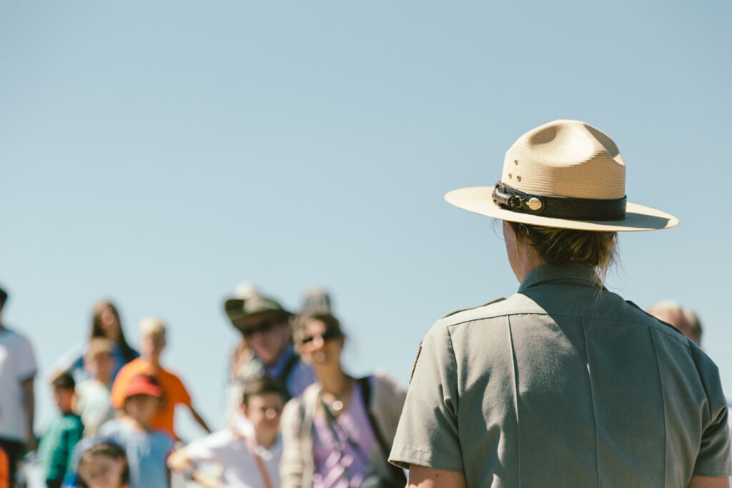 Park ranger addressing group outdoors