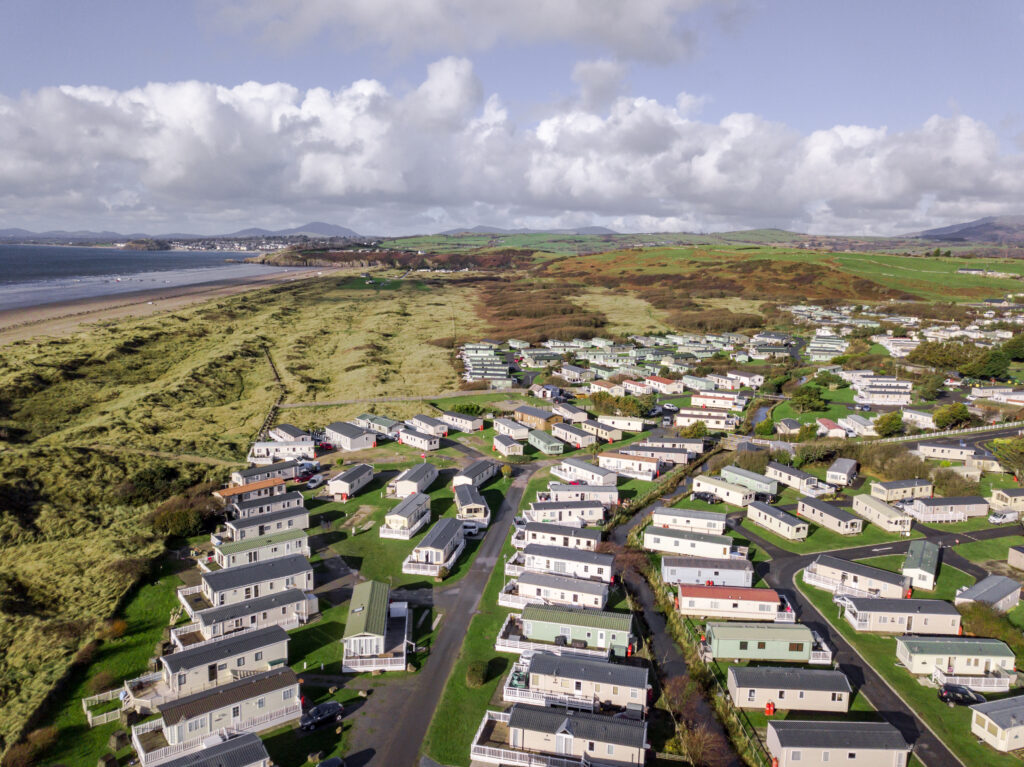 Aerial view of coastal mobile home park and beach.