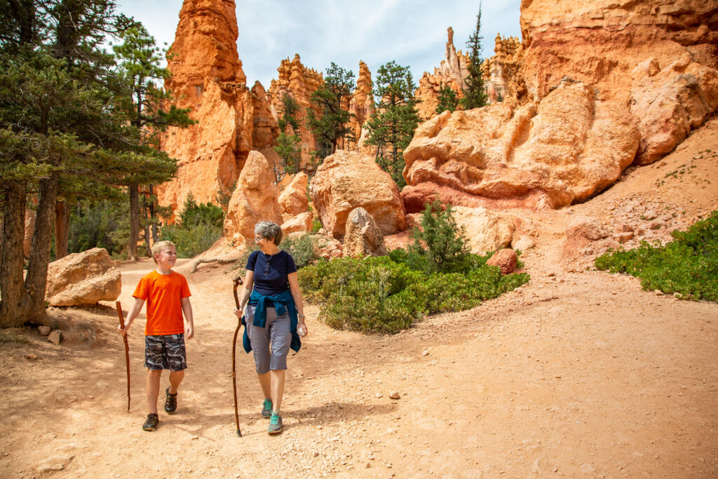 Two people hiking in scenic rocky landscape.